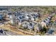 Expansive aerial view displays a dense residential community surrounded by lush greenery and winding roads at 720 Tannery Cmn, Alpharetta, GA 30009
