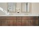 Bathroom vanity with double sinks, quartz countertops, and wooden cabinets with modern hardware at 720 Tannery Cmn, Alpharetta, GA 30009
