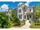 Charming two-story home with white siding, a landscaped yard, and inviting front porch at 720 Tannery Cmn, Alpharetta, GA 30009