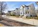 Attractive two-story white home with dark roof and a well-maintained front yard and sidewalk in a lovely neighborhood at 720 Tannery Cmn, Alpharetta, GA 30009