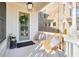 Inviting front porch featuring outdoor seating and charming decor, creating a welcoming entrance to the home at 720 Tannery Cmn, Alpharetta, GA 30009