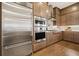 Gourmet kitchen featuring stainless steel appliances, wooden cabinets and hardwood flooring at 720 Tannery Cmn, Alpharetta, GA 30009