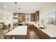 Beautiful kitchen with a large island, white countertops, stainless steel appliances, and wooden cabinets at 720 Tannery Cmn, Alpharetta, GA 30009