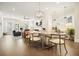 Spacious living area featuring hardwood floors, an open floor plan, and contemporary lighting at 720 Tannery Cmn, Alpharetta, GA 30009