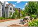 Scenic neighborhood with tree-lined sidewalks, benches, and manicured landscaping at 720 Tannery Cmn, Alpharetta, GA 30009