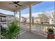 Covered porch with white columns and railings offering neighborhood views at 720 Tannery Cmn, Alpharetta, GA 30009