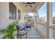 Inviting covered porch featuring cozy seating and neighborhood views at 720 Tannery Cmn, Alpharetta, GA 30009