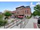 Commercial building with exterior patio seating featuring a ramp and staircase for accessibility and appealing architecture at 720 Tannery Cmn, Alpharetta, GA 30009