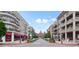 Street view of downtown Alpharetta with shops and apartments featuring balconies and awnings at 720 Tannery Cmn, Alpharetta, GA 30009