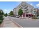 Street view of downtown Alpharetta with shops, cafes, and apartments featuring balconies and awnings at 720 Tannery Cmn, Alpharetta, GA 30009