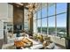 Bright living room with floor-to-ceiling windows offering stunning views, modern decor, and lots of light at 855 Peachtree Ne St # 1806, Atlanta, GA 30308