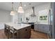 Contemporary kitchen with white subway tile backsplash, stainless steel appliances, and a large kitchen island at 120 Pinecone Pkwy, Alpharetta, GA 30022