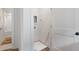 A compact laundry room with a utility sink, washer-dryer hookups, and white trim at 120 Pinecone Pkwy, Alpharetta, GA 30022