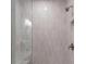 Contemporary walk-in shower featuring sleek fixtures, bright tile, and a built-in shelf at 120 Pinecone Pkwy, Alpharetta, GA 30022