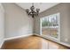 Dining room featuring hardwood floors, gray walls and a statement chandelier at 2006 Hawthorne Way, Woodstock, GA 30189