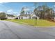 Charming single-story home with manicured lawn and lush landscaping at 2006 Hawthorne Way, Woodstock, GA 30189