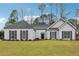 Charming single-story home featuring a well-manicured lawn and inviting entrance at 2006 Hawthorne Way, Woodstock, GA 30189