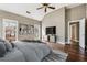 Spacious main bedroom with wood floors, vaulted ceiling, and abundant natural light at 2006 Hawthorne Way, Woodstock, GA 30189