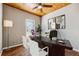 Cozy office featuring wood floors, modern computer and accessories, and a ceiling fan at 2006 Hawthorne Way, Woodstock, GA 30189