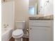 Bathroom featuring a toilet, vanity with granite countertop, and a shower with tiled walls at 3585 Ale Cir, Atlanta, GA 30344