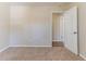 Neutral bedroom with carpet flooring, cream walls, and an open door leading into an adjoining room at 3585 Ale Cir, Atlanta, GA 30344