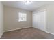 Cozy bedroom featuring neutral carpet, a large closet, and a window for natural light at 3585 Ale Cir, Atlanta, GA 30344