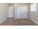 Bright bedroom featuring neutral carpet and a closet for ample storage space at 3585 Ale Cir, Atlanta, GA 30344
