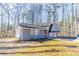 Charming split-level home featuring a two-car garage and a distinctive red front door at 3585 Ale Cir, Atlanta, GA 30344