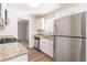 Bright kitchen features granite countertops, stainless steel appliances, and ample cabinet space at 3585 Ale Cir, Atlanta, GA 30344