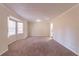 Open living room with neutral carpeting and a large window offering ample natural light at 3585 Ale Cir, Atlanta, GA 30344