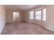 Spacious living room featuring neutral carpeting and a large bay window providing ample natural light at 3585 Ale Cir, Atlanta, GA 30344