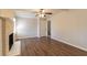 Spacious living room featuring a brick fireplace, ceiling fan, and hardwood-style floors at 3585 Ale Cir, Atlanta, GA 30344