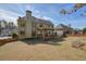 Large, grassy backyard featuring a deck, mature trees and partial fence at 4074 Gold Mill Rdg, Canton, GA 30114