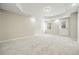 Finished basement with neutral walls, new carpet, recessed lighting, and walk-out access to the backyard at 4074 Gold Mill Rdg, Canton, GA 30114
