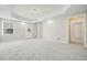 Finished basement with neutral walls, new carpet, recessed lighting, and walk-out access to the backyard at 4074 Gold Mill Rdg, Canton, GA 30114