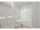 Bathroom featuring a vanity, toilet, and shower-tub combination with white tile surround at 4074 Gold Mill Rdg, Canton, GA 30114