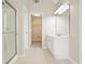 Clean and efficient bathroom featuring a shower, a vanity, and a walk-in closet at 4074 Gold Mill Rdg, Canton, GA 30114