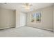 Cozy bedroom with natural light, plush carpeting, and a ceiling fan for added comfort at 4074 Gold Mill Rdg, Canton, GA 30114
