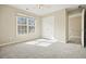 Inviting bedroom with a large window bringing in sunshine and plush carpeting at 4074 Gold Mill Rdg, Canton, GA 30114