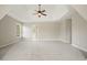 Large bedroom boasts a tray ceiling and ample space, ready for your personal touch at 4074 Gold Mill Rdg, Canton, GA 30114