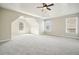 Spacious bedroom featuring neutral tones, a tray ceiling, and multiple windows at 4074 Gold Mill Rdg, Canton, GA 30114