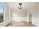 Dining area with hardwood floors, decorative trim, modern lighting, large windows and neutral walls at 4074 Gold Mill Rdg, Canton, GA 30114