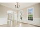 Dining area with hardwood floors, decorative trim, large windows, neutral walls and modern lighting at 4074 Gold Mill Rdg, Canton, GA 30114