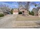 Traditional two-story brick home features an attached two-car garage, mature trees, and manicured lawn at 4074 Gold Mill Rdg, Canton, GA 30114
