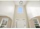Entryway featuring soaring ceilings with large windows, letting in natural light and highlighting the open floor plan at 4074 Gold Mill Rdg, Canton, GA 30114