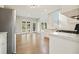 Modern kitchen open to living area, featuring stainless appliances and backyard view at 4074 Gold Mill Rdg, Canton, GA 30114