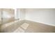 Spacious room with wood floors, neutral walls, modern trim, and lots of natural light at 4074 Gold Mill Rdg, Canton, GA 30114