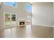 Large, bright living room features high ceilings, a cozy fireplace, hardwood floors, and large windows at 4074 Gold Mill Rdg, Canton, GA 30114