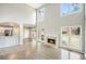 Bright living room featuring high ceilings, a fireplace, and natural light at 4074 Gold Mill Rdg, Canton, GA 30114