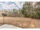 Sprawling backyard with green space and mature trees at 1732 Broad River Rd, Atlanta, GA 30349
